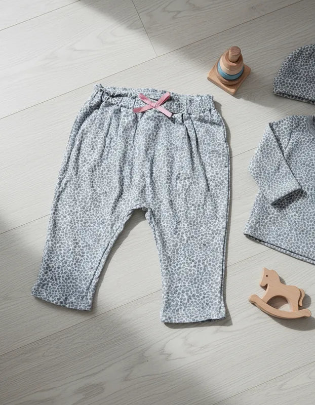 Pantalon niña tipo calza leopardo con moña